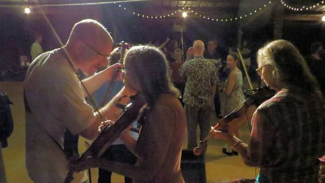 Planet Banjo confers while Nancy teaches the dance.... photo credit John Johnson